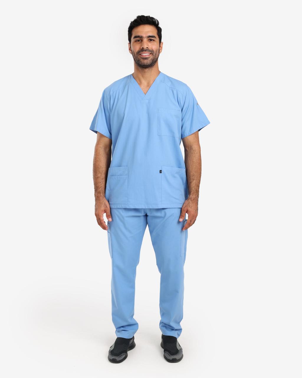 Man wearing a light blue scrub top and cargo scrub pants